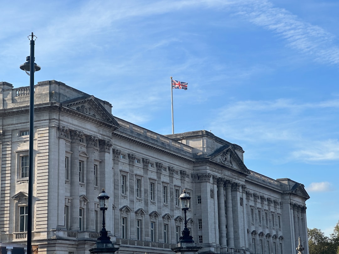 a large white building with a flag on top of it